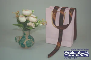 روبان قهوه ای در کنار ساک دستی و چاپ