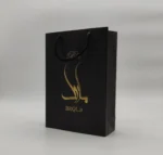 چاپ بگ گلاسه مشکی 17×24 با چاپ طلاکوب تیراژ 1000 عددی