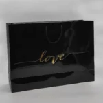 بگ گلاسه براق مشکی 52×36 با چاپ طلاکوب love تیراژ 1000 عددی