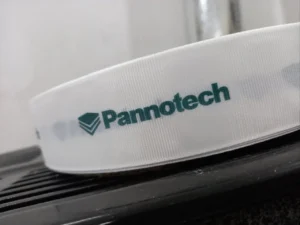 روبان کبریتی سفید عرض 4 سانتی متری با چاپ panootech سبز متراژ 1000 متر