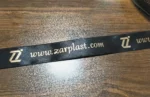 روبان 1/5 سانتی متری مشکی با چاپ طلایی ZARPLAST تیراژ 1000 متری