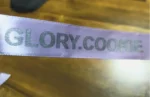 روبان سفید 2 سانتی متری با چاپ نقره ای GLORY.COOKIE تیراژ 1000 متری