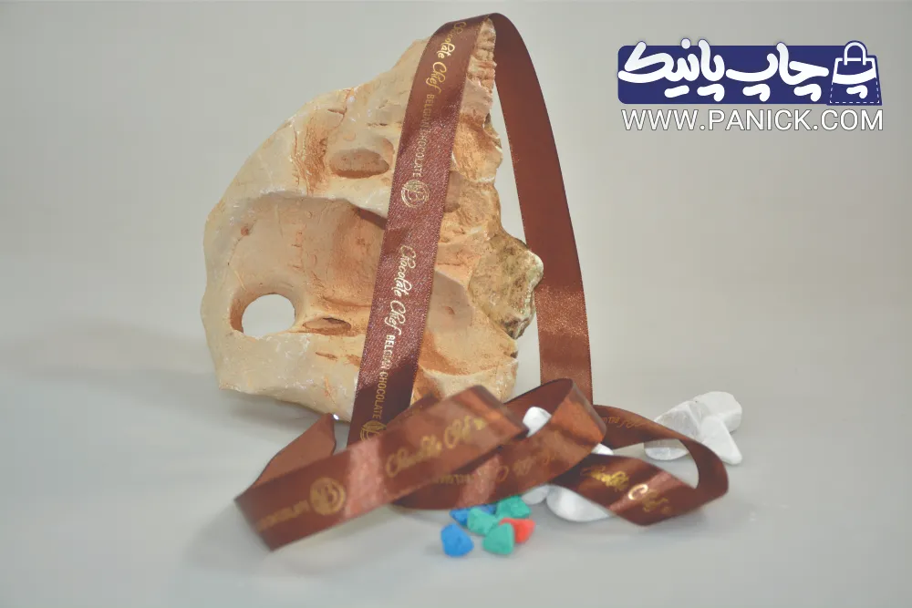 ROBANPANICK-165 روبان زرد ۲/۵ سانتی با چاپ قهوه ای