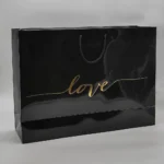 بگ گلاسه براق مشکی 52×36 با چاپ طلاکوب love تیراژ 1000 عددی