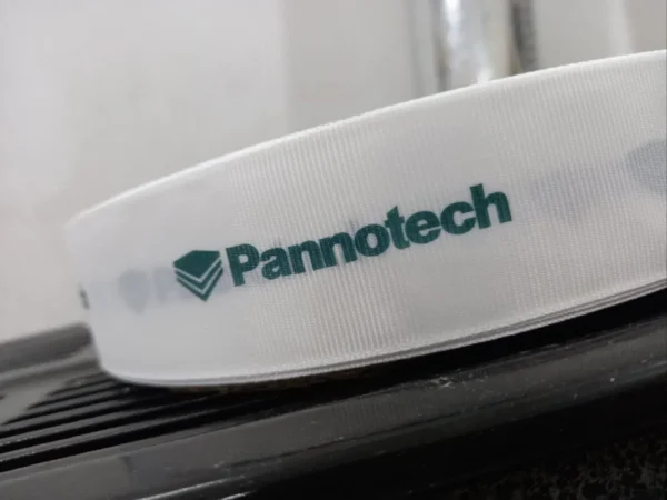 روبان کبریتی سفید عرض 4 سانتی متری با چاپ panootech سبز متراژ 1000 متر