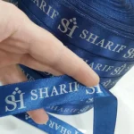 روبان سرمه ای 2/5 سانتی متری با چاپ نقره ای sharif متراژ 1000 متری