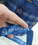 روبان سرمه ای 2/5 سانتی متری با چاپ نقره ای sharif متراژ 1000 متری
