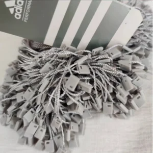 سفارش چاپ تگ مقوایی adidas به همراه نخ پلمپ طوسی تیراژ 1000 عددی