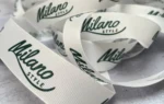 روبان سفید کبریتی 2/5 سانتی متری با چاپ سبز MILANO STYLE متراژ 1000 متری