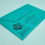 چاپ پوشه دکمه دار سبز طلاکوب مشکی شرکت مغناطیس سازان حیات تیراژ 1000 عددی