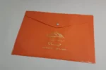 چاپ پوشه دکمه دار نارنجی گروه مشاورین املاک جانا تیراژ 1000 عددی